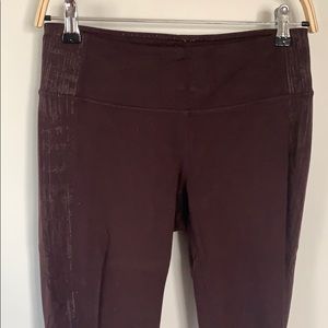 Athleta burgundy leggings with silver detail